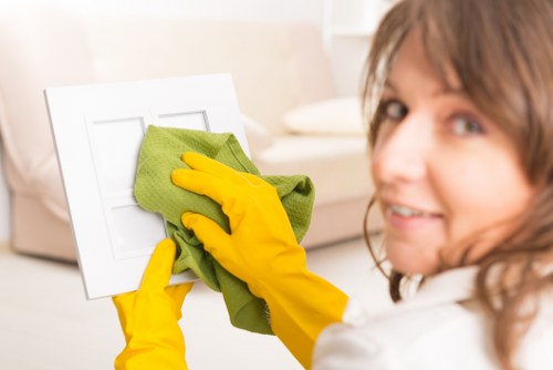 Local window cleaner working on a Queenspark home exterior